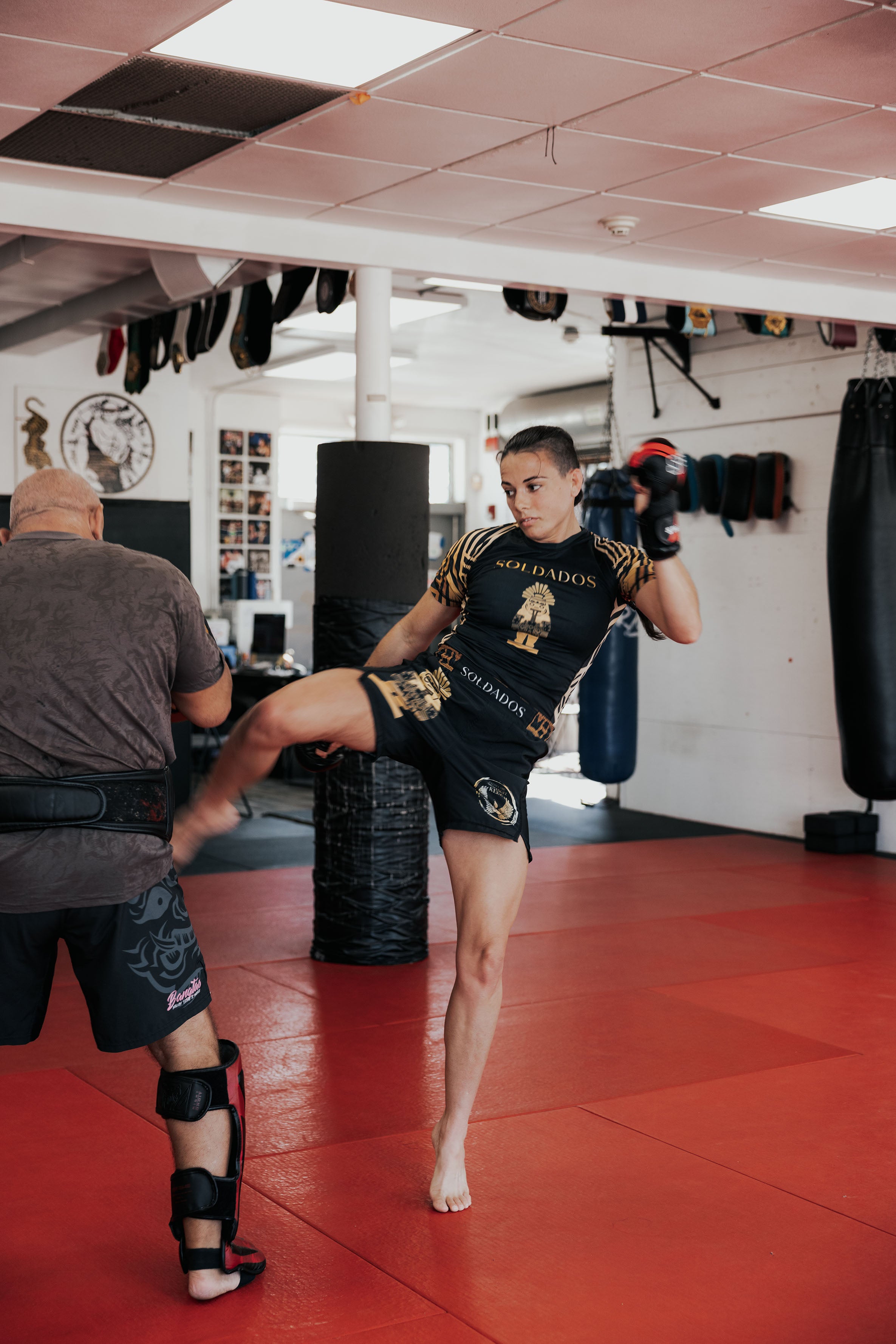 <img src="soldados-womens-mma-grappling-shorts.jpg" alt="Fatima Kline wearing Mens MMA and Grappling Shorts by Soldados Coffee x ILSV Apparel Co.">